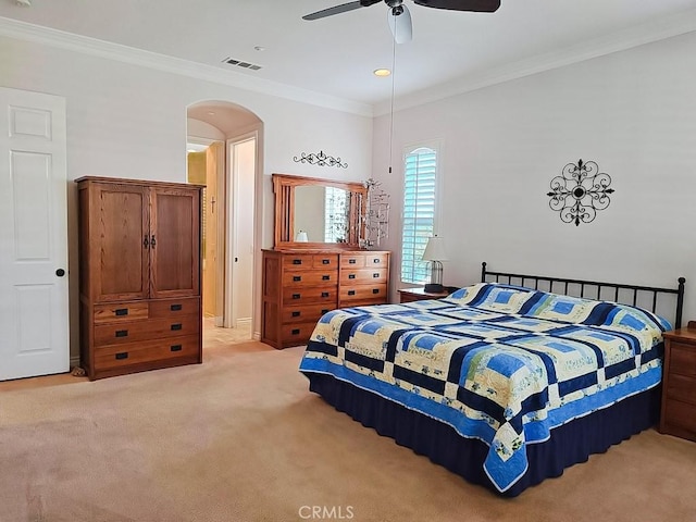 bedroom with ceiling fan, crown molding, and light carpet