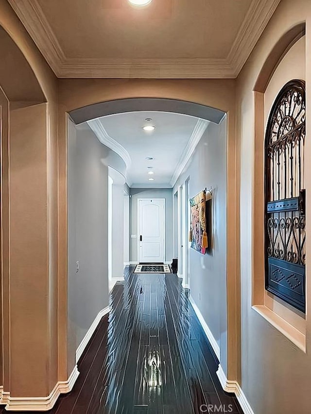 corridor featuring dark hardwood / wood-style floors and ornamental molding