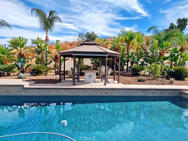 view of swimming pool with a gazebo