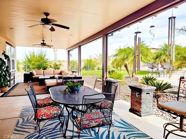 view of patio / terrace with an outdoor living space and ceiling fan