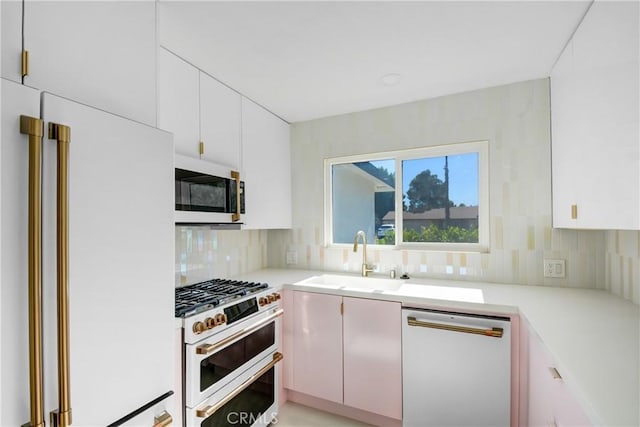 kitchen featuring white cabinets, sink, and stainless steel appliances