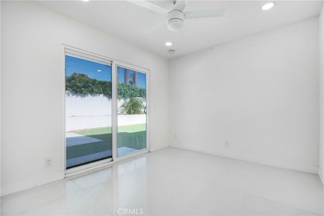 spare room with ceiling fan and a water view