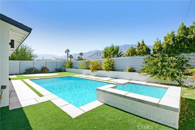 view of swimming pool with a mountain view