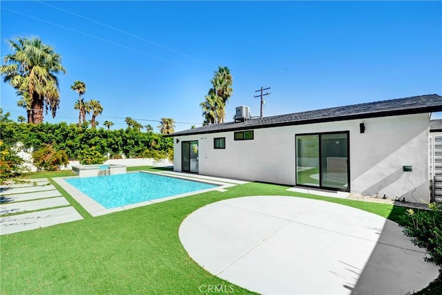 view of pool featuring a patio area, a yard, and cooling unit