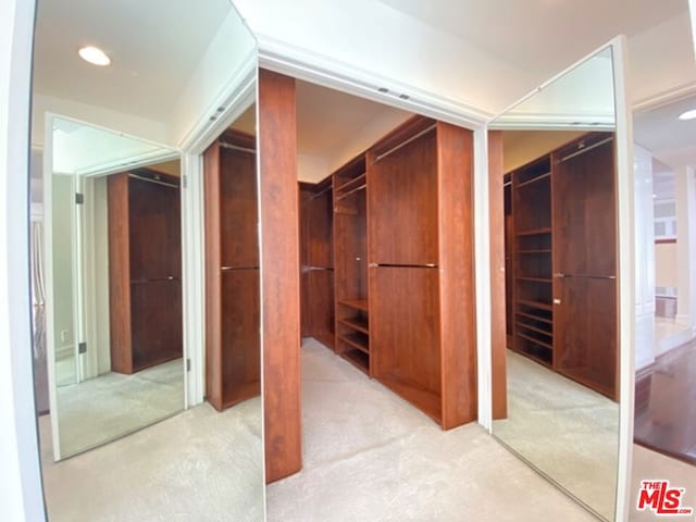 hallway with light colored carpet