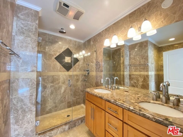 bathroom with a shower with shower door, tile walls, and crown molding