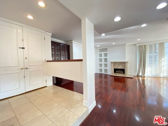 entryway featuring a high end fireplace