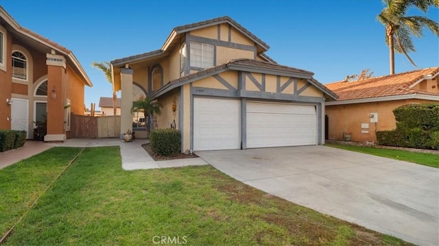 view of front of property with a garage and a front yard