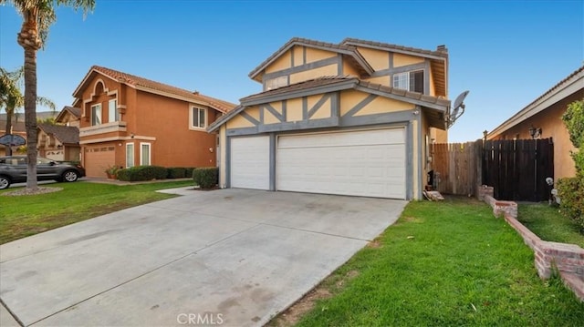 view of front of property featuring a front yard and a garage