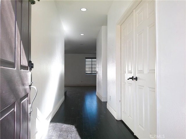 corridor featuring dark hardwood / wood-style floors