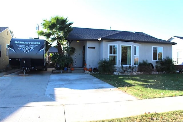 ranch-style home with a front yard