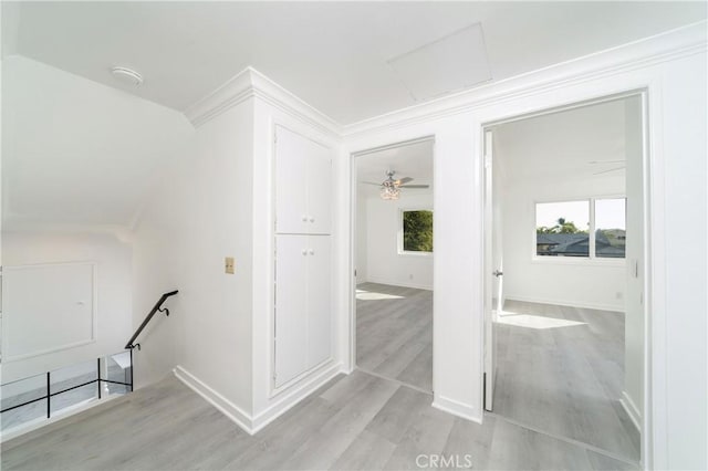 corridor with light hardwood / wood-style flooring