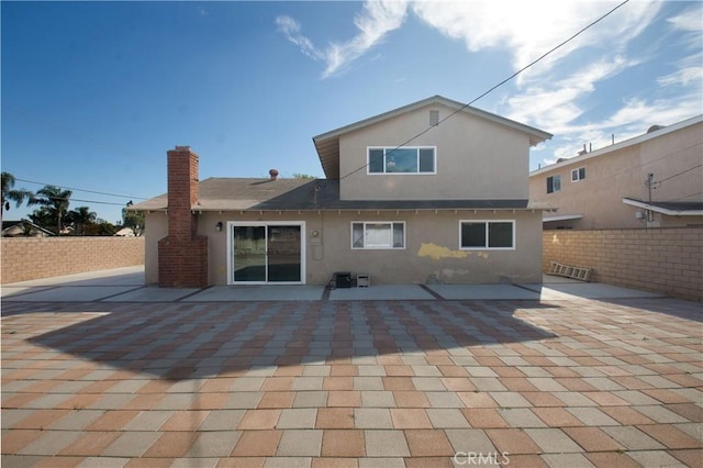 back of property featuring a patio area