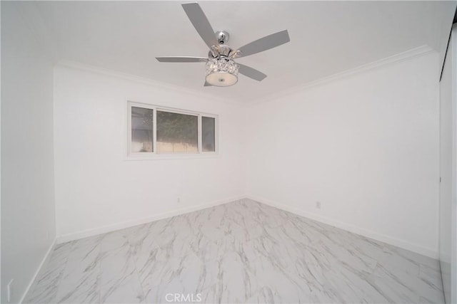 spare room featuring ceiling fan and crown molding