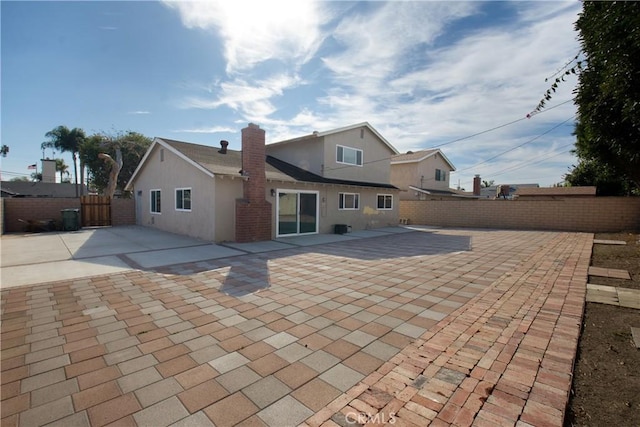 rear view of property with a patio area