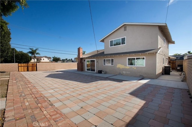 back of property featuring a patio area