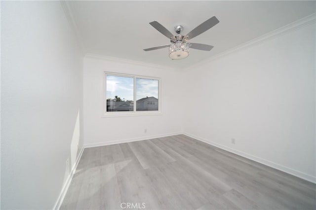 empty room with light wood-type flooring, ceiling fan, and crown molding