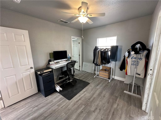 office area with hardwood / wood-style floors and ceiling fan