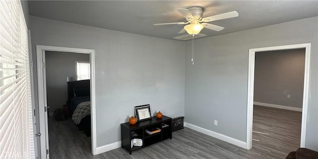 unfurnished room featuring hardwood / wood-style floors and ceiling fan