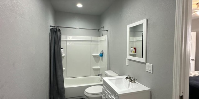 full bathroom featuring vanity, shower / bath combo, and toilet