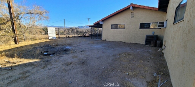 view of yard with central AC unit