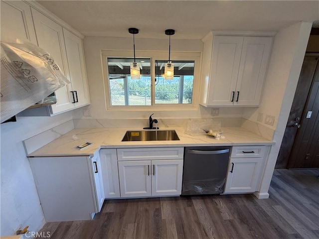kitchen featuring white cabinets, dishwasher, and a sink