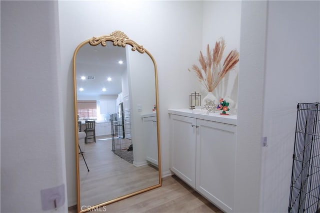 hall with light hardwood / wood-style floors