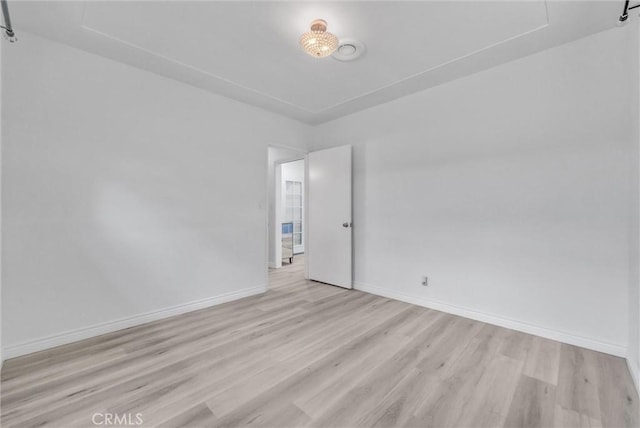 spare room with light wood-type flooring