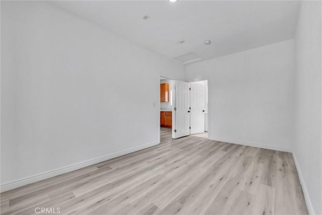 unfurnished room featuring light hardwood / wood-style floors