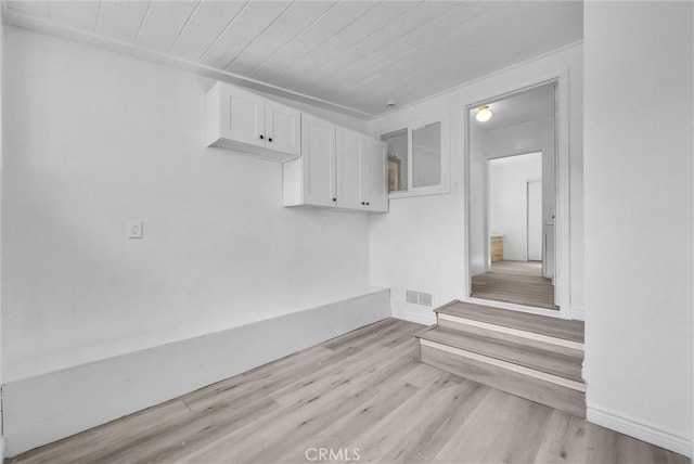 interior space featuring hardwood / wood-style flooring and wood ceiling