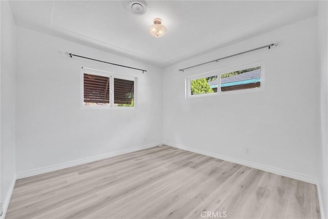 unfurnished room with light hardwood / wood-style floors