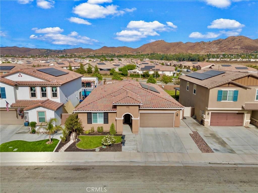 view of front of home featuring a mountain view and a garage