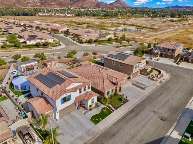 birds eye view of property with a mountain view