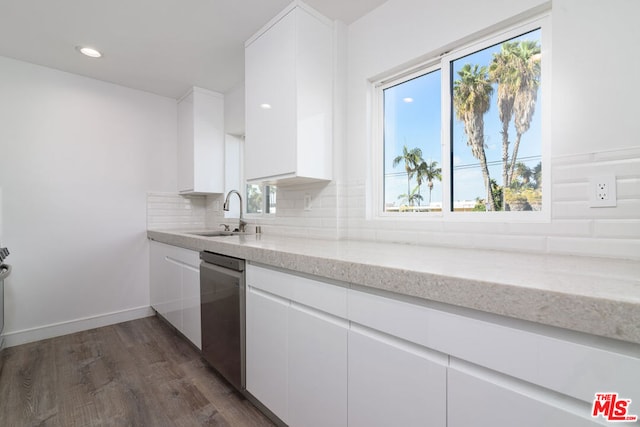 kitchen featuring sink, white cabinets, and stainless steel dishwasher