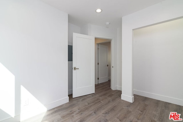 unfurnished bedroom featuring hardwood / wood-style floors