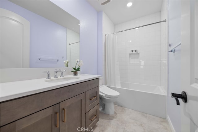 full bathroom with tile patterned floors, shower / tub combo with curtain, vanity, and toilet