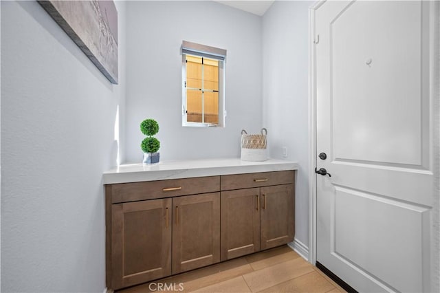 bathroom featuring vanity and wood-type flooring