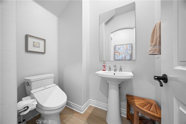 bathroom featuring tile patterned floors and toilet