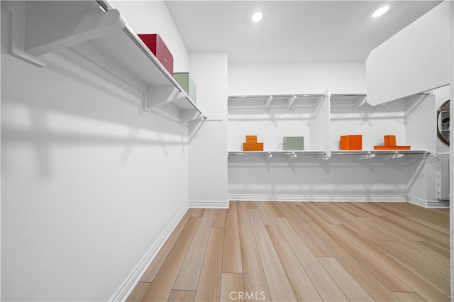 walk in closet featuring hardwood / wood-style flooring