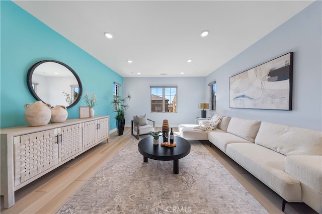 living room with light hardwood / wood-style flooring and a mail area