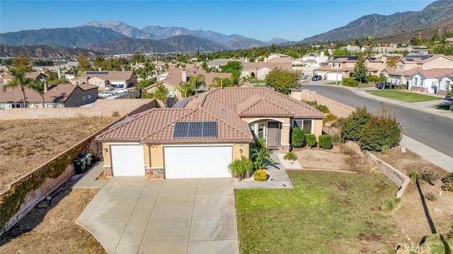 drone / aerial view featuring a mountain view