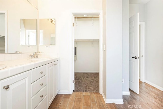 bathroom featuring hardwood / wood-style floors and vanity