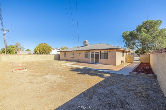 rear view of property featuring central AC unit