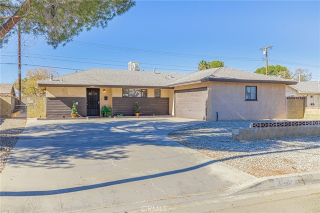 ranch-style home with a garage