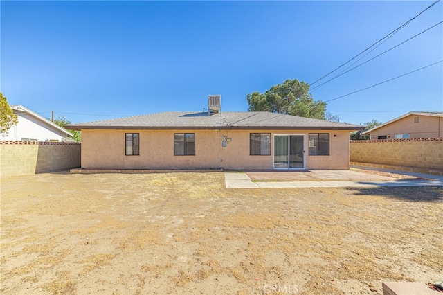 back of property with central AC unit