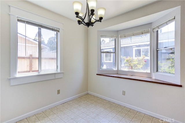 empty room with a chandelier