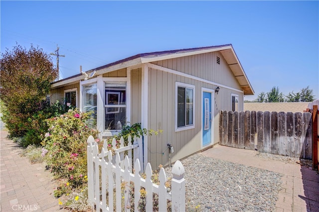 view of side of property with a patio area