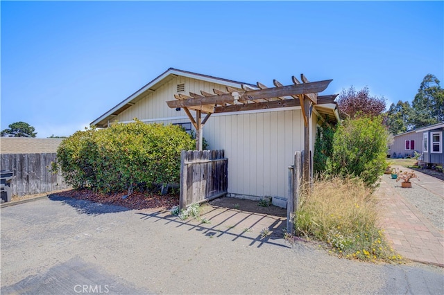 view of home's exterior featuring a pergola