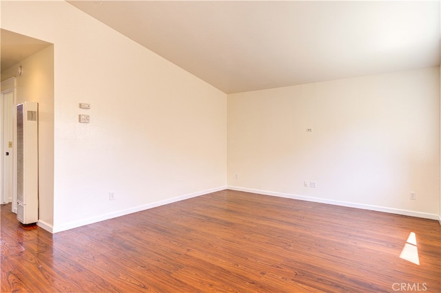 unfurnished room featuring dark hardwood / wood-style flooring