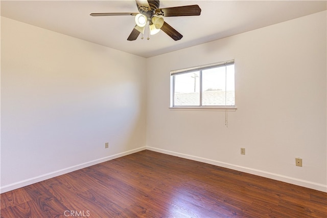 empty room featuring dark hardwood / wood-style floors and ceiling fan